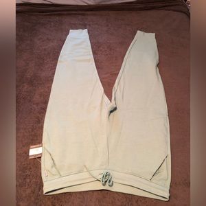 Teal fuzzy joggers from Eddie Bauer with the tag on